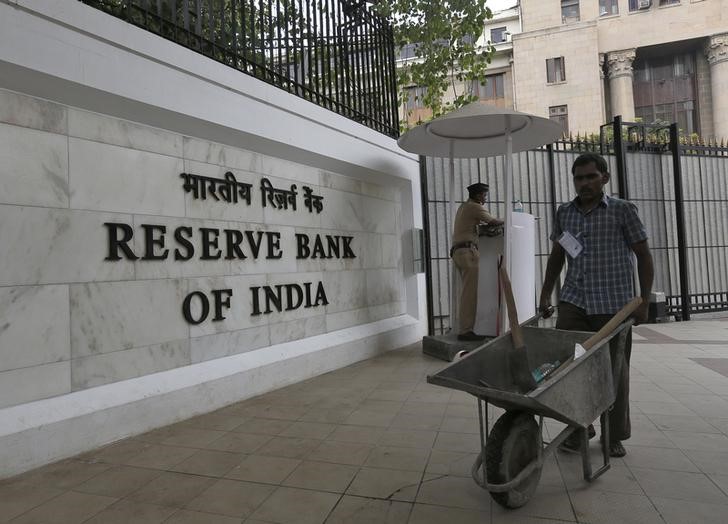 A worker pushes a wheelbarrow inside the Reserve Bank of India head office in Mumbai